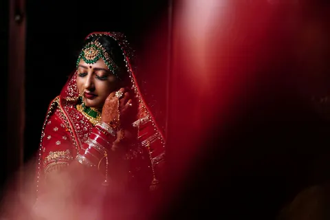 A bride in a dim room, lit from one side