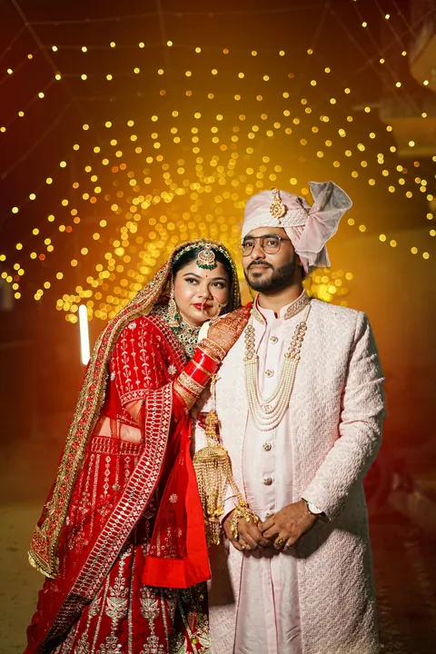 A couple posing together at night